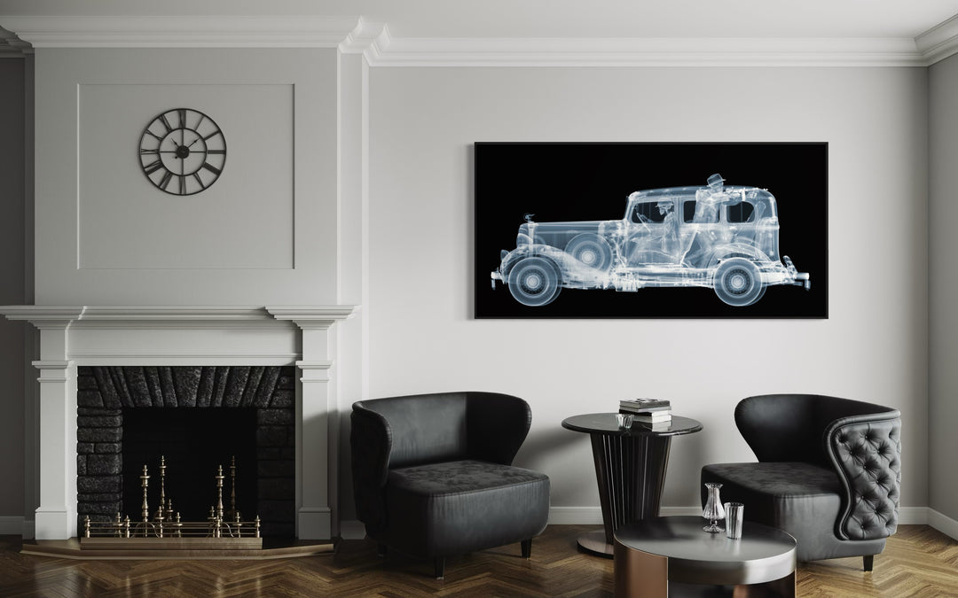 Framed Chromaluxe black and white x-ray photograph by Nick Veasey of a skeleton 1930s gangsters in a pontiac getaway car, pointing a vintage machine gun