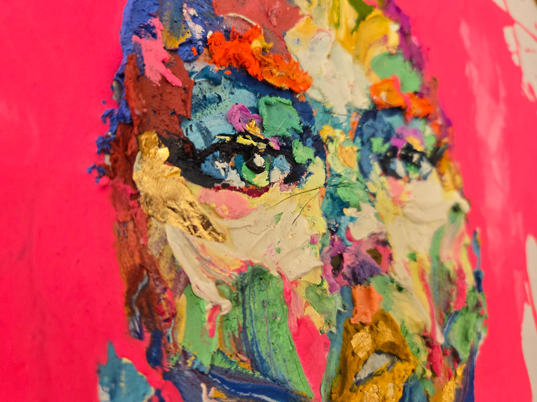 front facing portrait of woman with pink splattered paint hair and skin made of green red blue yellow purple and pink in impasto thick acrylic with details of gold foil and gestural marks of color at bottom of canvas on white background