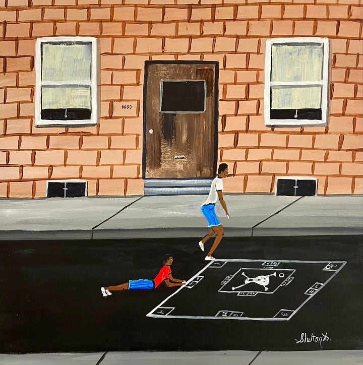 two boys playing blacktop game outside of brick building 