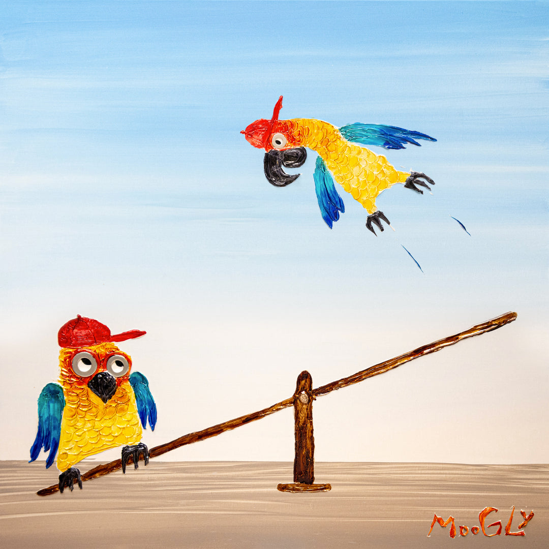 30” x 30” painting by French artist Moogly of two blue and yellow parrots with red baseball caps on a see-saw. One parrot is jumping on one end of the see-saw, making the other parrot fly up in the air. The parrots are made out of resin, giving them a textured and shiny finish. Their eyes are made out of washers that the artist has adhered to the canvas.