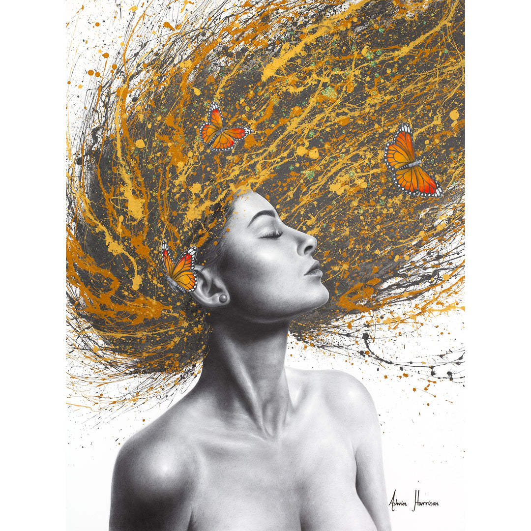 profile woman in black and white flipping hair over head in black yellow orange and gold splatter paint with orange monarch butterflies in hair on white background