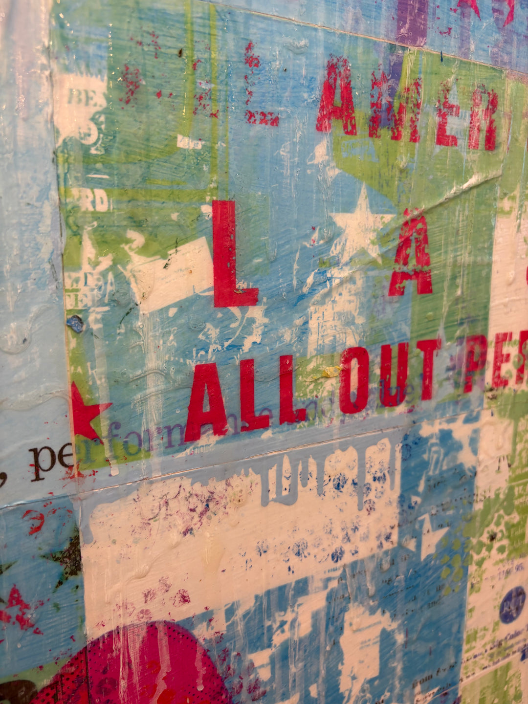All Out Performance by Jon Davenport — angled detail of Neo-Pop mixed media painting showing weathered "All Out Performance" typography with stars and distressed texture