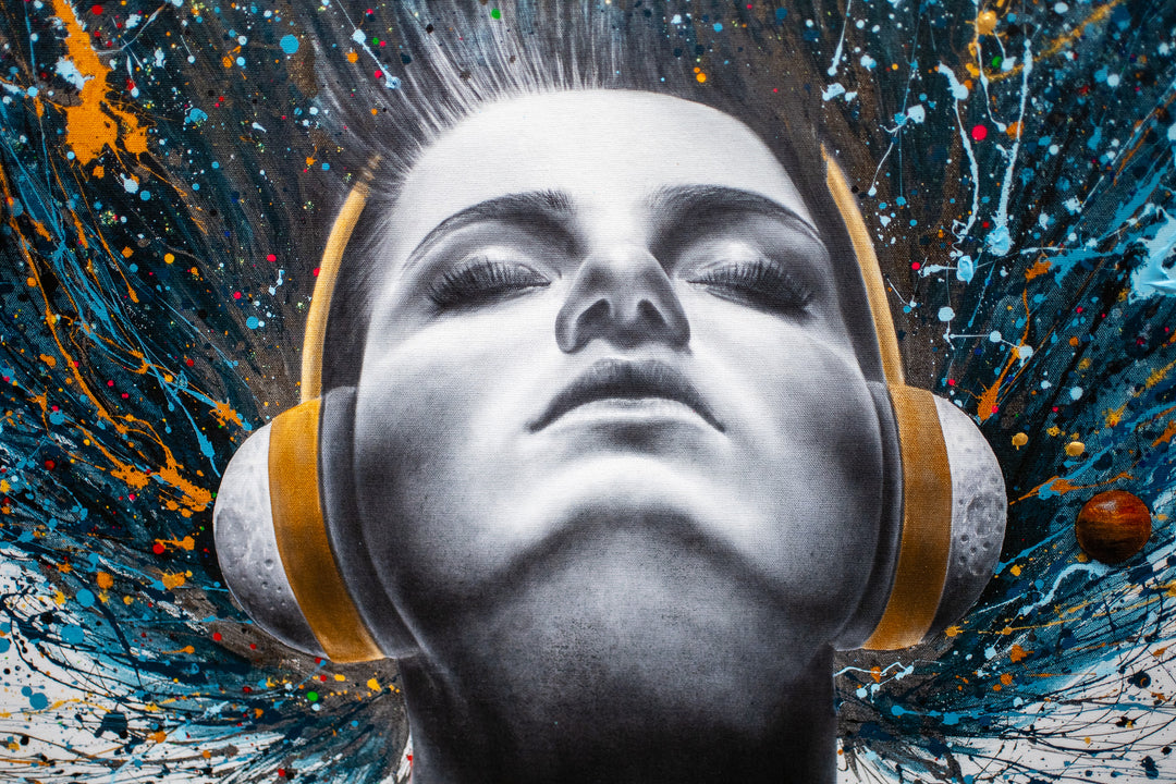 Woman figure looking upwards with eyes closed, wearing headphones with blue splattered hair behind her flying upwards with planets floating around on white background