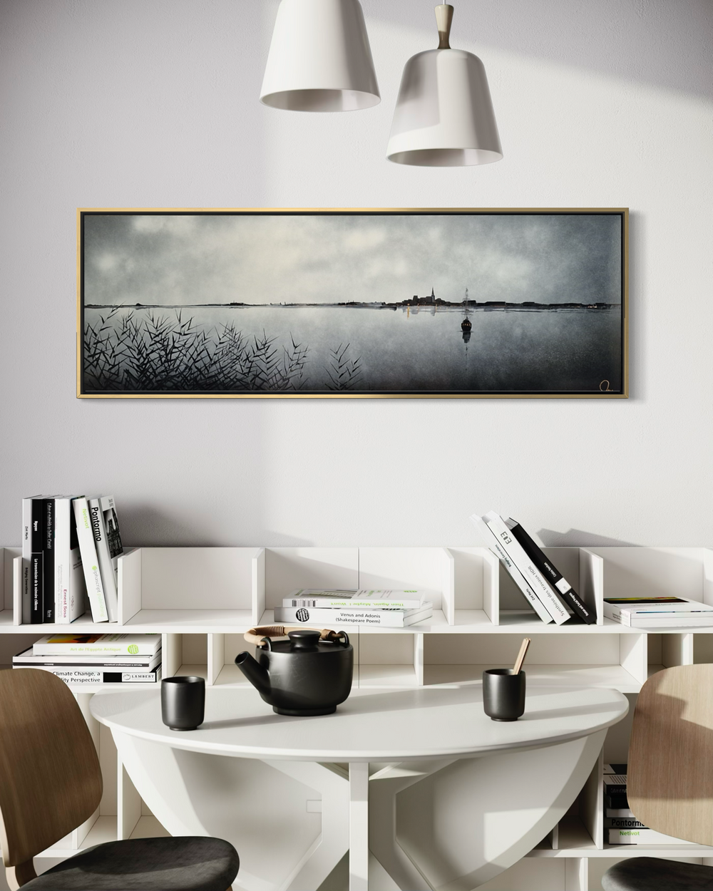 Julien Rey, Au Bord De L'Eau, lacquer and gold leaf on board, 16 x 47 inches, shown framed above a round dining table with black ceramics, in a room with a bookshelf and pendant lamps.
