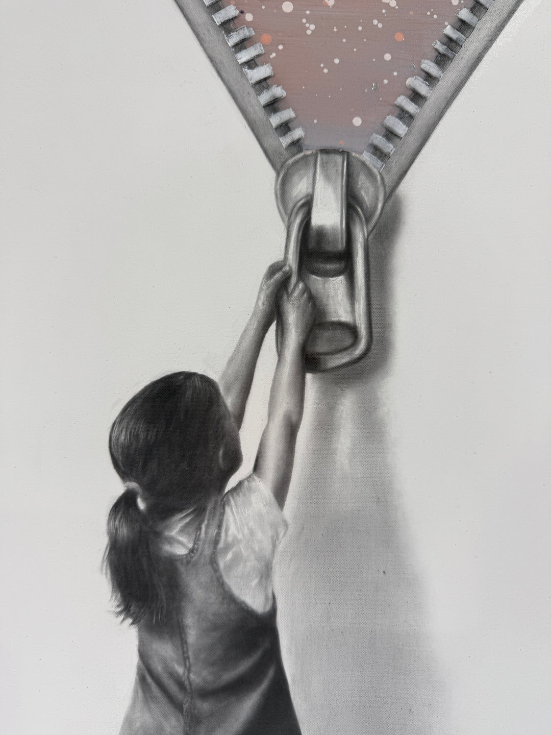 Beyond The Wall Of Reality’ by Ashvin Harrison is a contemporary surrealist painting featuring a monochromatic young girl pulling down a large zipper to reveal a vibrant dreamlike sky filled with colorful hot air balloons, cosmic splatter effects, and deep blue twilight tones. Created with coconut charcoal dust and acrylic on canvas, this mixed-media artwork contrasts realistic grayscale portraiture with expressive abstract color, symbolizing imagination, wonder, and escape beyond reality