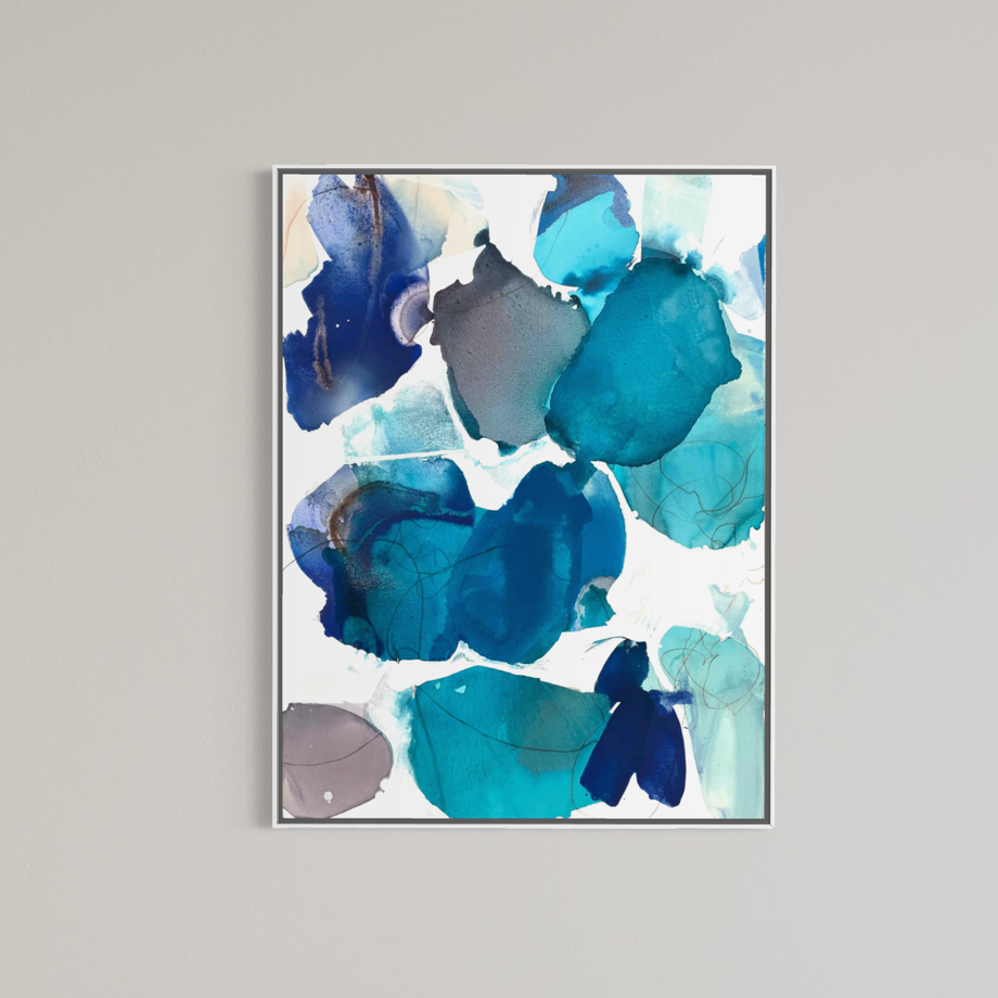 Mockup of "Blue Beach Glass 1" by Liz Barber shown in a white frame against a neutral gray wall