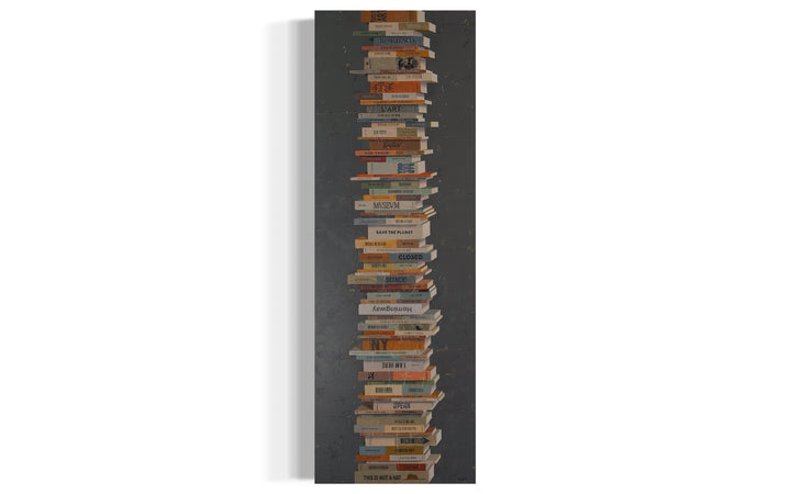 Books In Balance II, artwork by Tomasa Martín. Oil and acrylic on linen, vertical painting of stacked books on a charcoal gray bcackground.