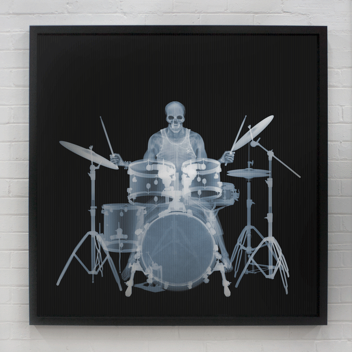 Framed Lenticular black and white x-ray photograph by Nick Veasey of a skeletal drummer 