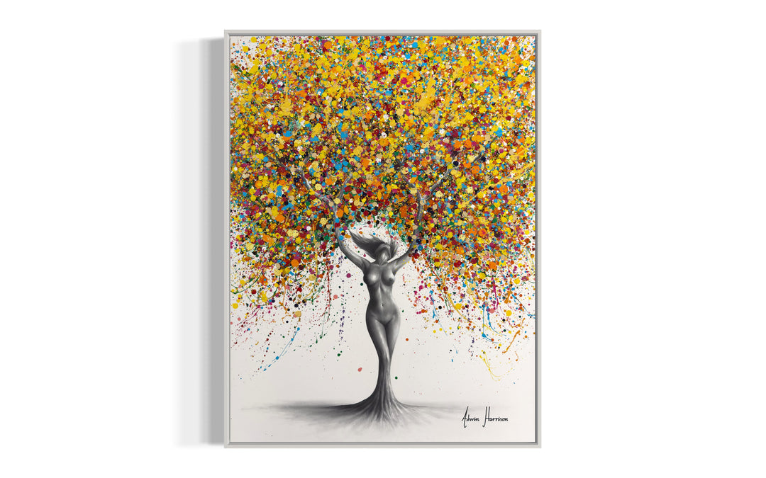 Existential Essence by Ashvin Harrison. Nude woman in black and white coconut charcoal with legs morphing into a tree trunk, her arms as branches and leaves are splattered colored paint