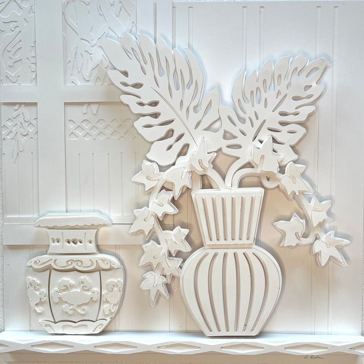 14"x14" layered white paper forming a fern in a striped vase on a wall. 