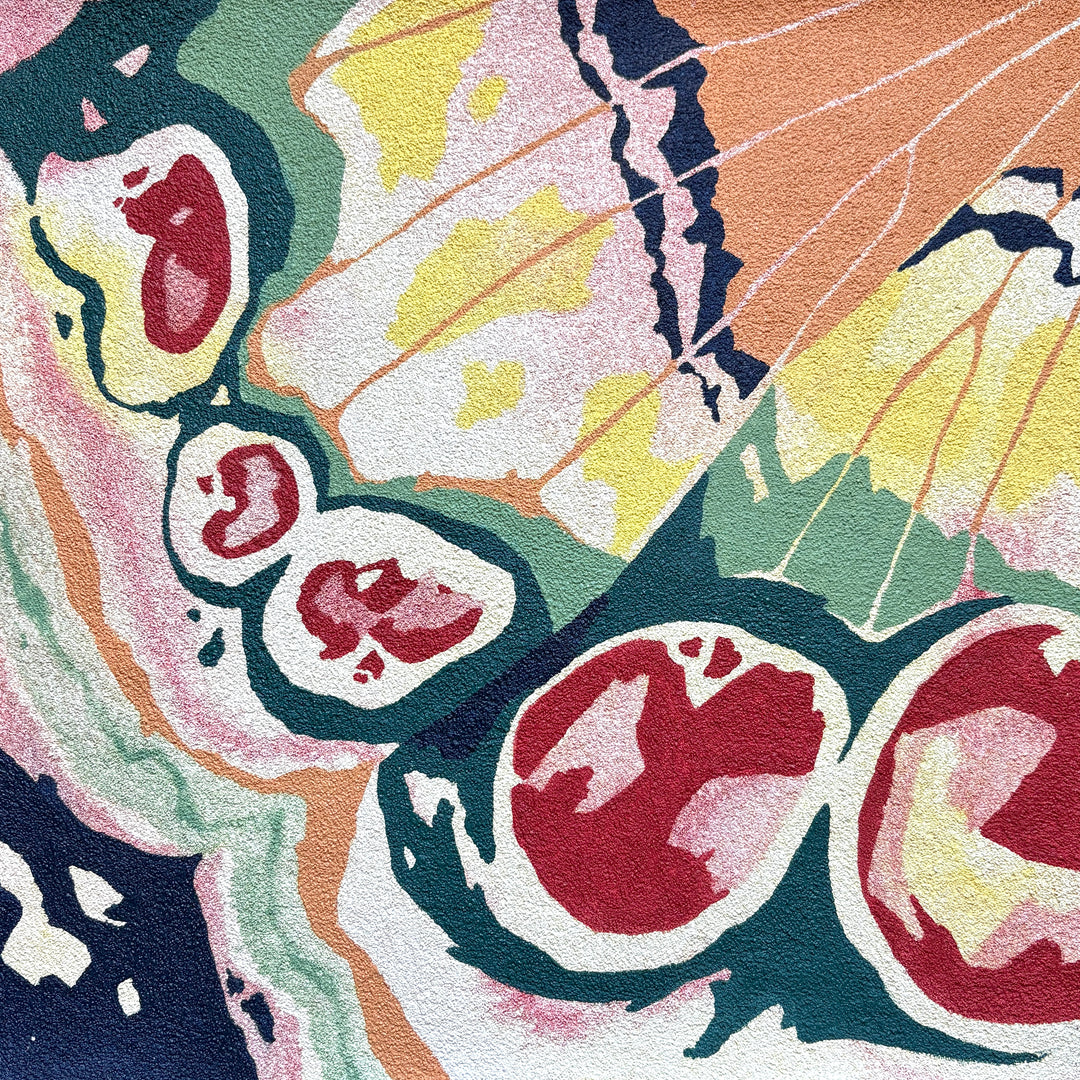 close up detail butterfly wing organic shapes design nature in red green yellow and orange gradient opaque oil paint on pumice