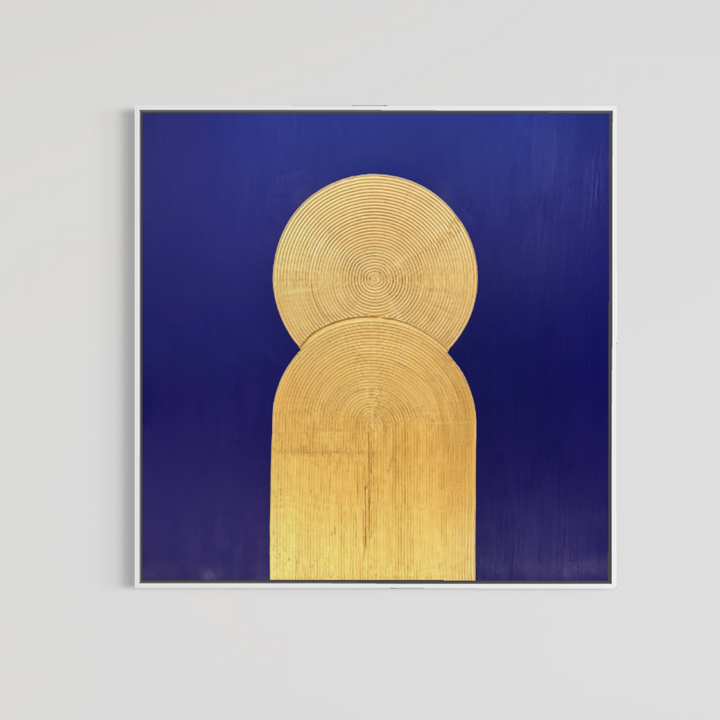 Lee in Cerulean, Halo Vaste I, joint compound and acrylic paint on canvas, 48 x 48 inches. Square deep blue painting with a gold circle and arch in a thin white float frame on a light grey wall.