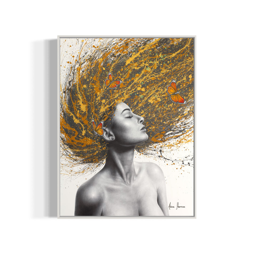 black and white profile woman flipping her hair on gold orange yellow and black splatter hair with orange monarch butterflies in hair on white background