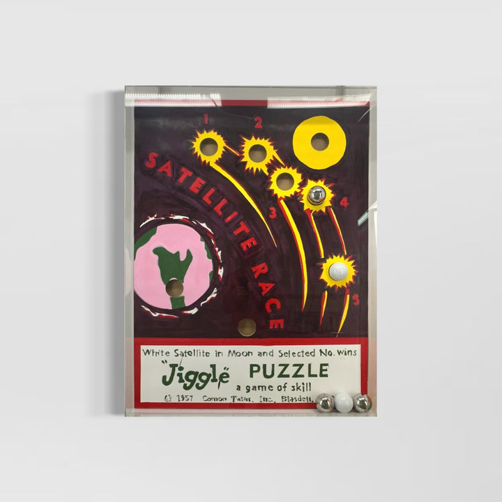 mixed media puzzle collage in plexiglass satellite race kid game nostalgia vintage retro ball jiggle puzzle graphic 