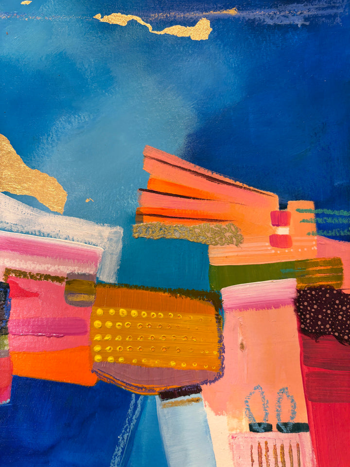 abstract colorful collage in paint graphite fabric patterns gold leaf stacked and over layed on bright blue background