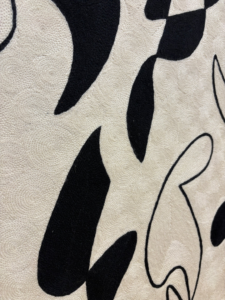 abstract shapes doodles line work in black and white negative space solid heavy chain stitched textile fabric embroidery