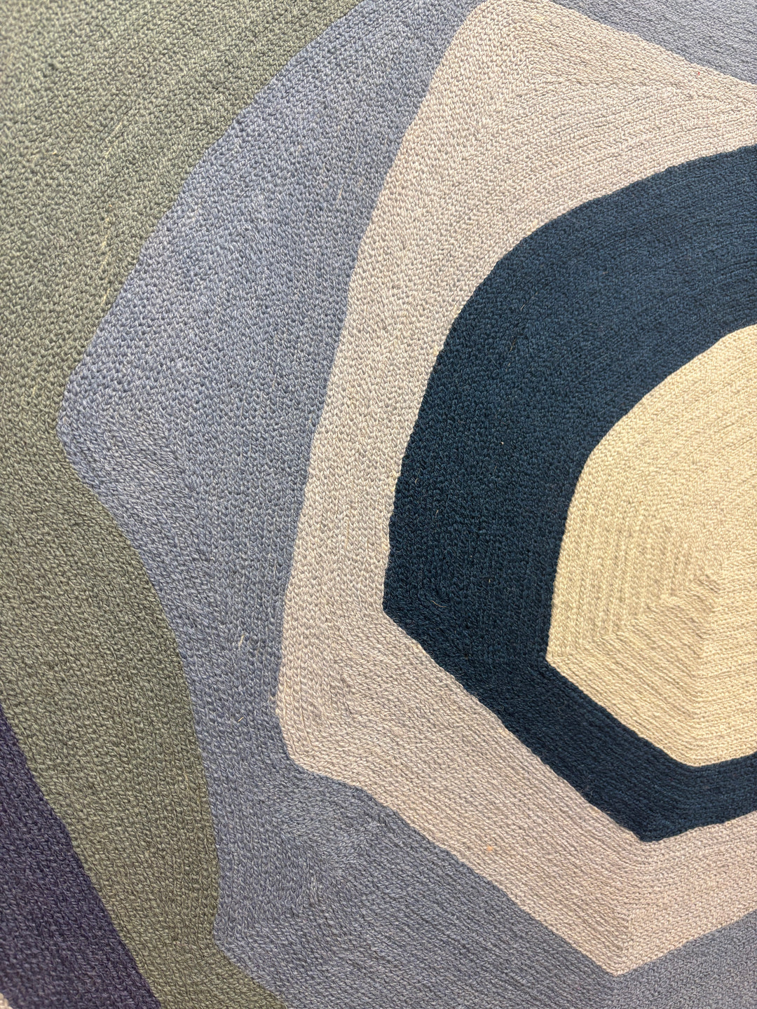 43"x42.5" chain-stitched textile with blue hues in a geometric form. 