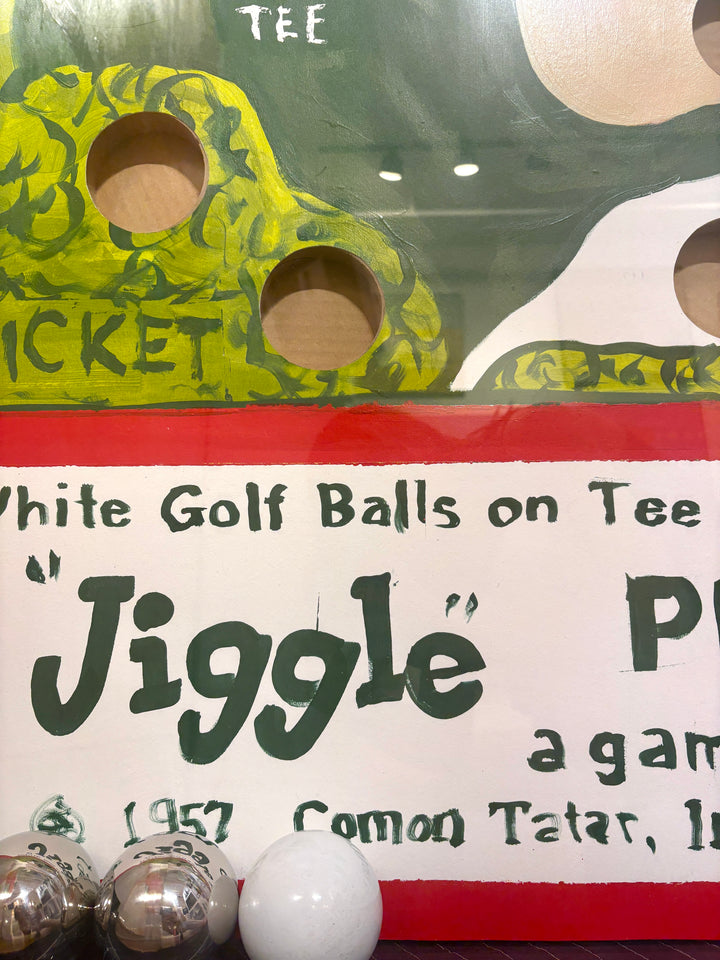 Graphic vintage nostalgic jiggle puzzle game with balls green golfing with hitting figure golf map tee. and holes in acrylic and plexiglass frame
