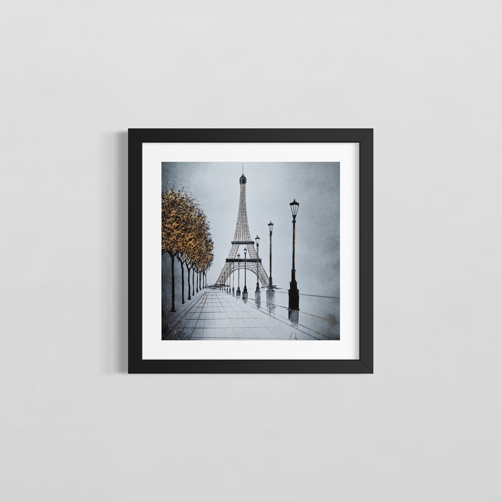 "In Paris" by French artist Julien Rey — a mixed-media painting on board of the Eiffel Tower from a Parisian boulevard, crafted with Chinese lacquer and gold leaf. A tree-lined avenue with classic street lamps leads the eye toward the iconic iron tower, its structural details accented in gold leaf. Autumn trees with luminous gold foliage frame the misty silver-gray composition. Original contemporary Eiffel Tower Paris painting on board available at Morton Contemporary gallery.