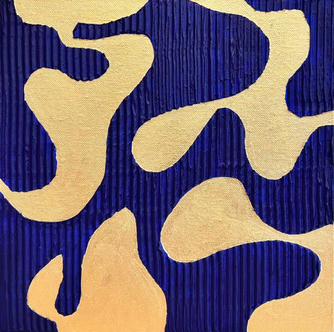minimal geometric abstract organic shape in gold with lines  straight on blue background