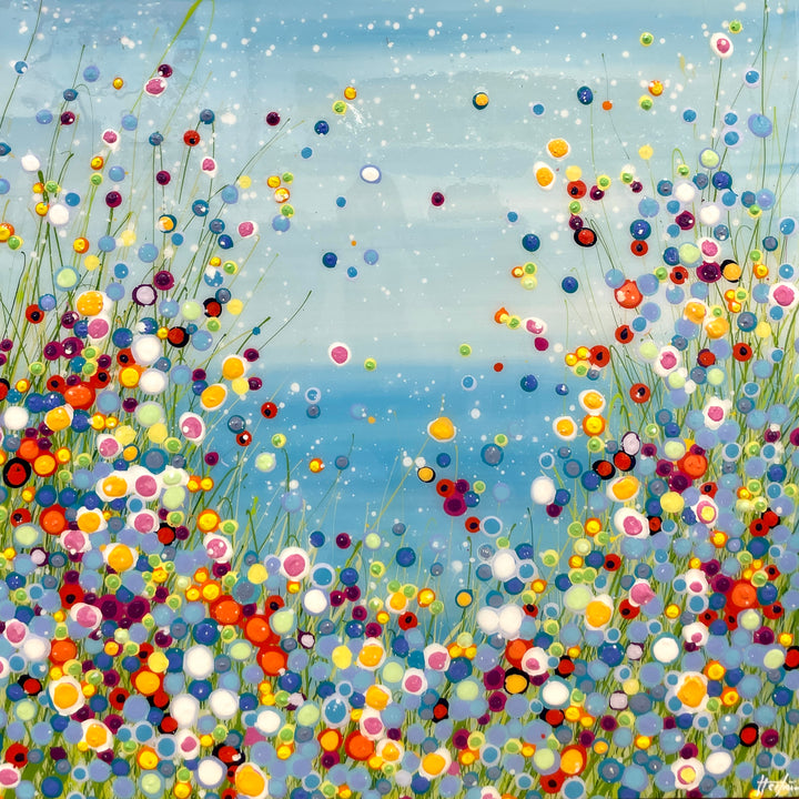 resin polkadots all over canvas in rainbow colors with sky blue background and white dots
