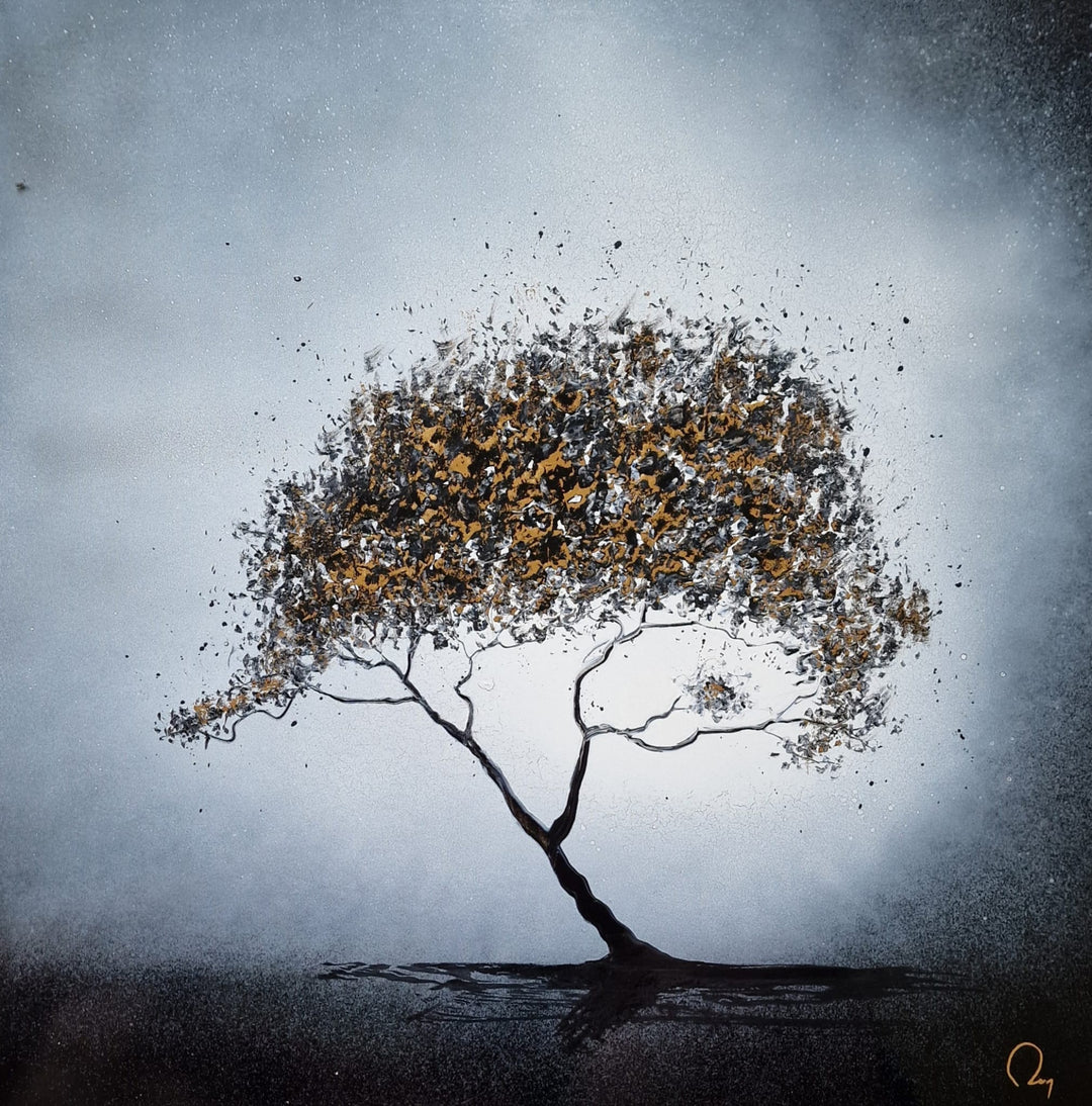 "Lovely Nature" by French artist Julien Rey — a mixed-media painting on board of a solitary windswept tree, crafted with Chinese lacquer and gold leaf. A slender leaning trunk supports an expansive, fragmented canopy of gold leaf and dark lacquer foliage bursting outward against a luminous silver-gray sky. The dynamic composition evokes resilience, movement, and the untamed beauty of nature. Original contemporary botanical tree painting on board available at Morton Contemporary gallery.