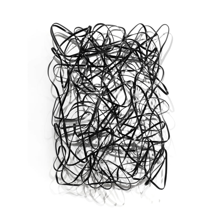 Matt Devine, 1984, powder-coated aluminum, made to order from 11 to 84 inches. Vertical rectangular wall sculpture of thin black aluminum ribbons bent into tangled, overlapping loops on a white wall.