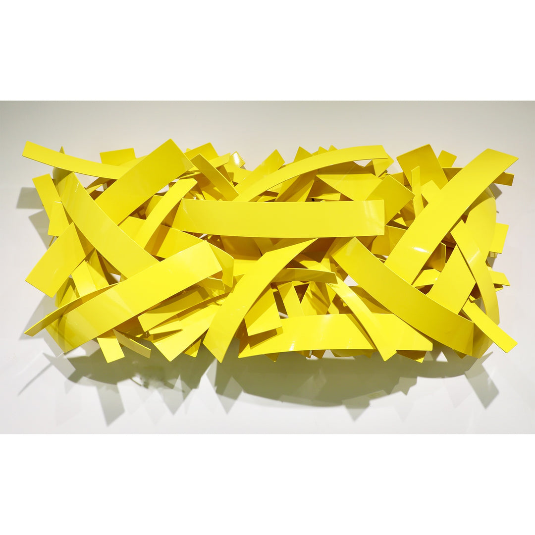Matt Devine, Mixed Bands, powder-coated aluminum, made to order from 11 to 84 inches. Horizontal rectangular wall sculpture of flat yellow aluminum bands in mixed widths, layered in a crisscross pattern on a white wall.