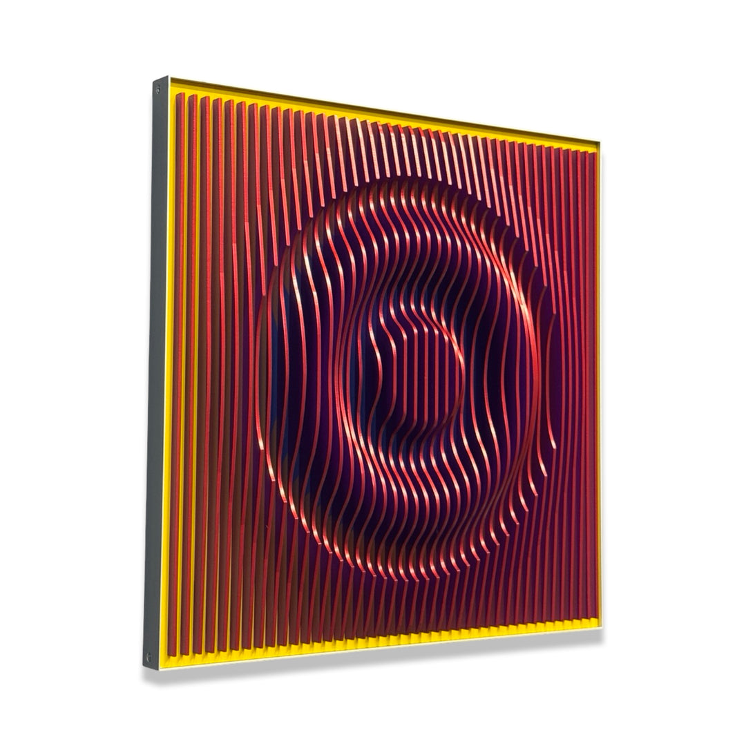 vertical stripes plexiglass abstract geometric with yellow and orange in back and pulsing round circular middle in blue when viewed at angle mostly red