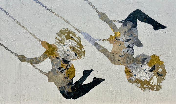 Swinging Silhouettes II by Christopher Peter. Wide-format mixed media painting of two female figures on chains, their silhouettes filled with gold, silver, and taupe patterned collage papers against a soft white-gray canvas.