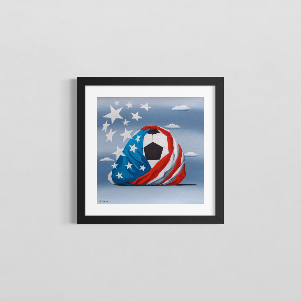 "Soccer in USA" by Italian artist Carlo Trevisan — a surrealist oil painting on canvas depicting a classic black and white soccer ball dramatically wrapped in a billowing American flag, with oversized white stars bursting free against a cloudy blue sky. The bold, celebratory composition unites the world's most popular sport with American national pride. Original contemporary surrealist American soccer football pop art painting on canvas available at Morton Contemporary gallery.