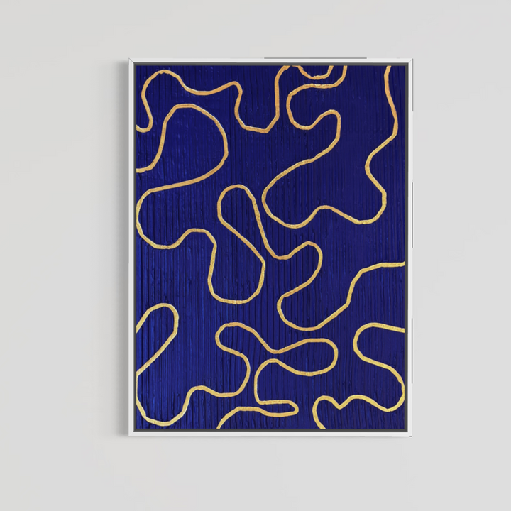 Lee in Cerulean, Vaste Wilderness, joint compound and acrylic paint on canvas, 48 x 36 inches. Deep blue painting with looping gold lines in a thin white float frame on a light grey wall.