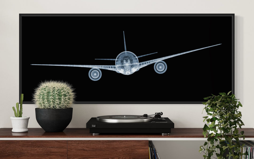 Framed Chromaluxe x-ray photograph by Nick Veasey of a mechanical jet on black background
