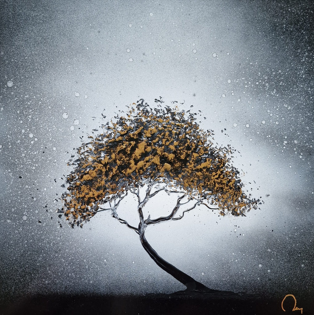 "Winter Tree" by French artist Julien Rey — a mixed-media painting of a solitary tree crafted with Chinese lacquer and gold leaf on canvas. A gracefully curved black trunk supports a luminous canopy of gold leaf and dark lacquer, set against a soft silver-gray atmospheric background with delicate white droplets evoking snow or mist. A contemplative, minimalist composition balancing strength and fragility. Original contemporary botanical painting available at Morton Contemporary gallery.