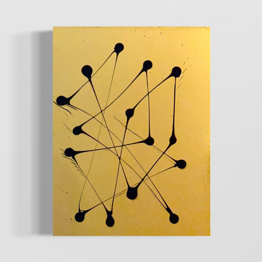abstract minimal dots with lines connecting in black paint on gold shiny smooth reflective surface by m clark