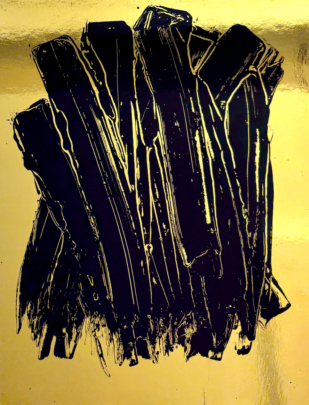 expressionistic long swatches of black paint vertically on shiny reflective smooth gold surface by artist m clark