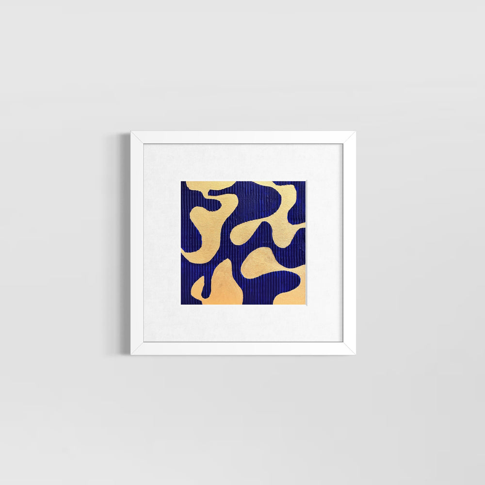 minimal geometric abstract organic shape in gold with lines  straight on blue background