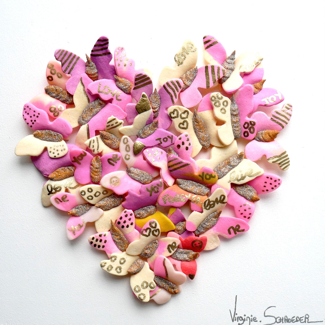 3 dimensional textured artwork of butterflies with text and floral collage on white background with pink and beige clay model paste acrylic in heart shape