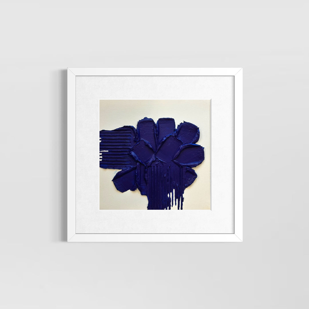 Layered blue joint compound with lines scraped out on sides on white background