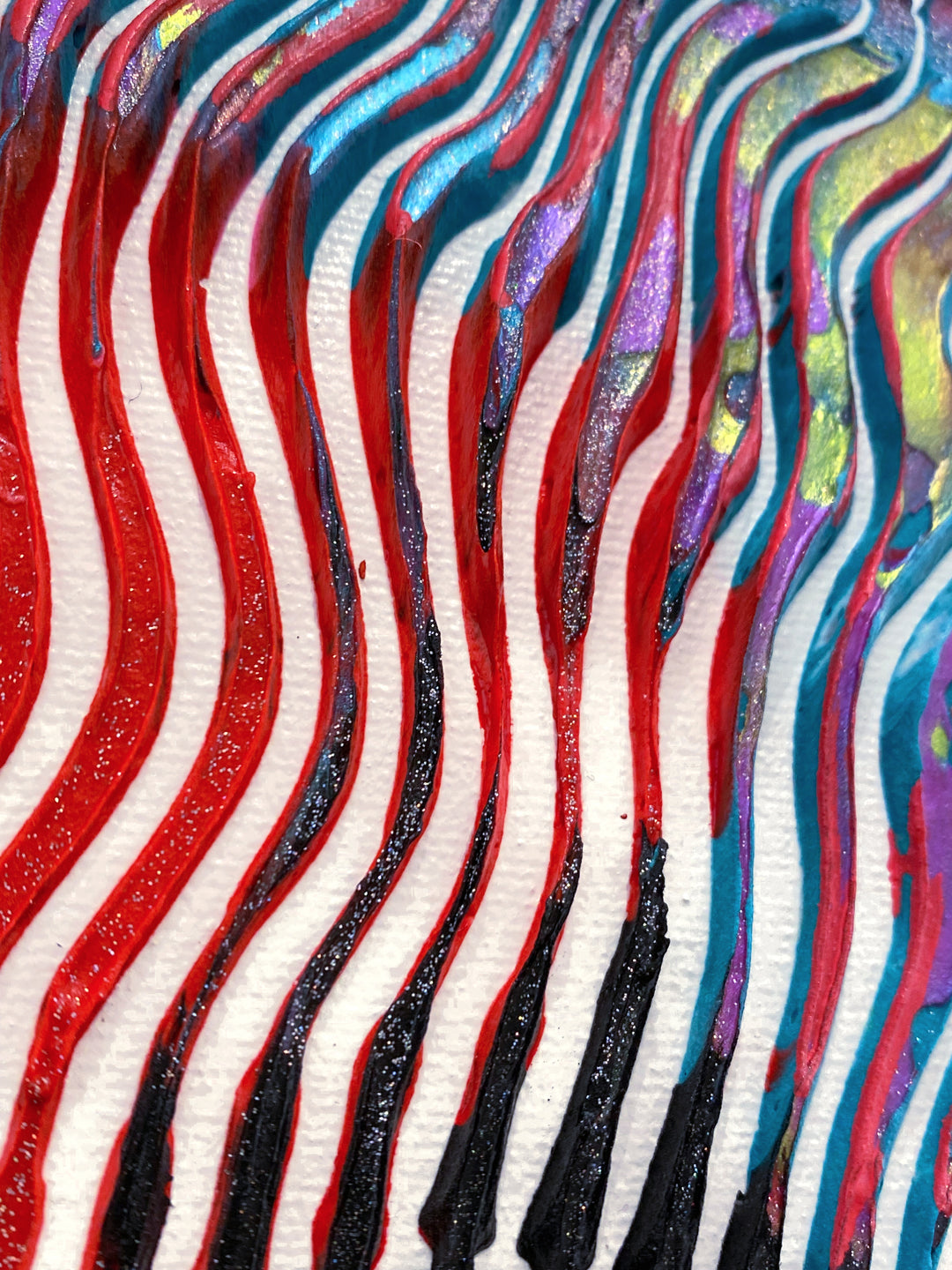 Detail of Virginie Schroeder "The Most Iconic, David Bowie", 10" x 10" white and multicolor abstract portrait painting. Acrylic and oil on canvas.