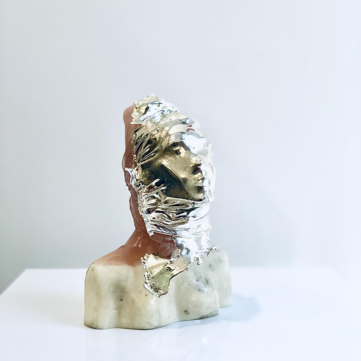 Girl With Mask, sculpture by Michal Cimala. Polyester resin and galvanized silver with polyurethane. 4.75 by 3.25 by 2.5 inches.
