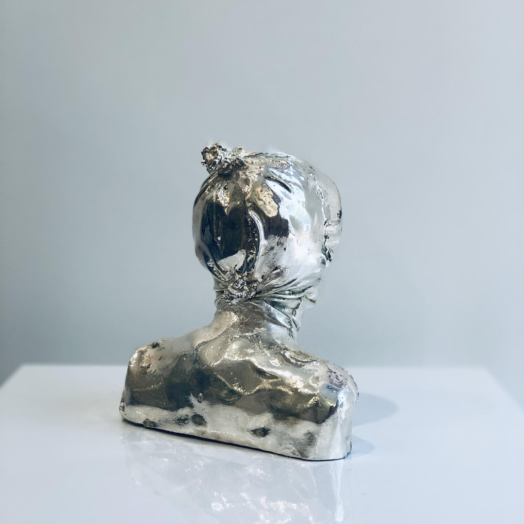 Untitled, artwork by Michal Cimala. Galvanized silver with polyurethane. 4.75 by 4.75 by 2.5 inches.
