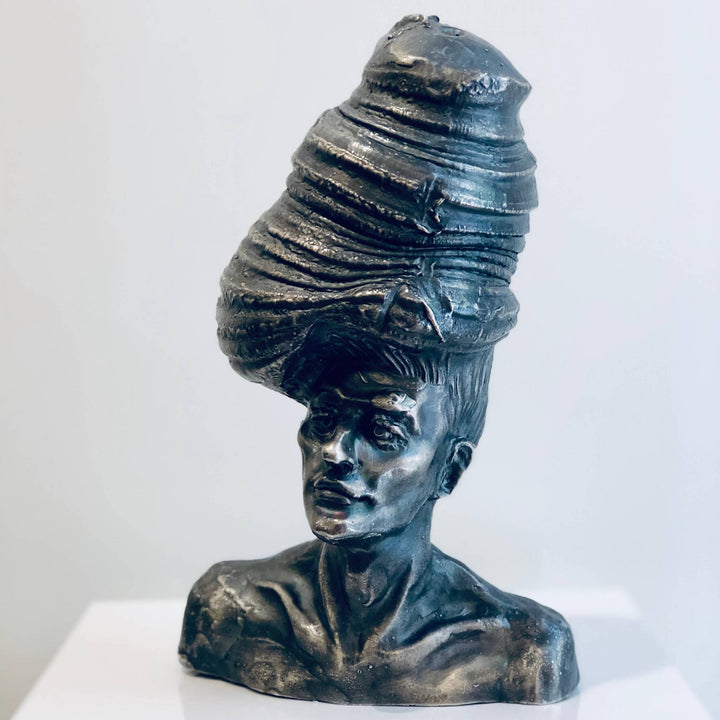 Shit On The Top, sculpture by Michal Cimala. Galvanized silver with polyurethane. 8 by 4.75 by 4.75 inches.