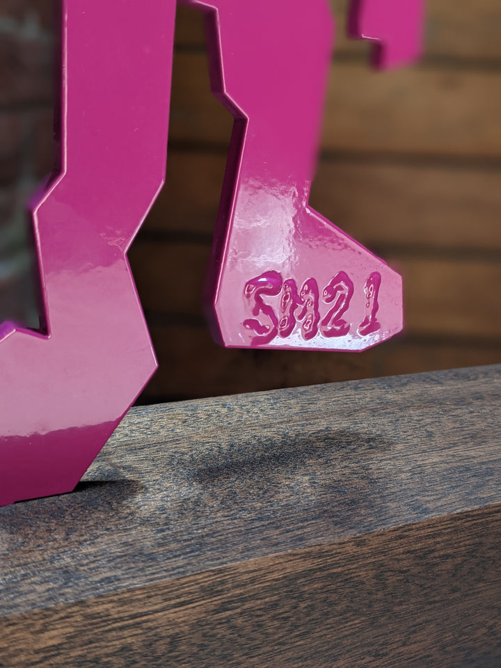 detail of The Wanderer, sculpture by Stikman. Laser-cut powder coated steel. 13 inches tall.