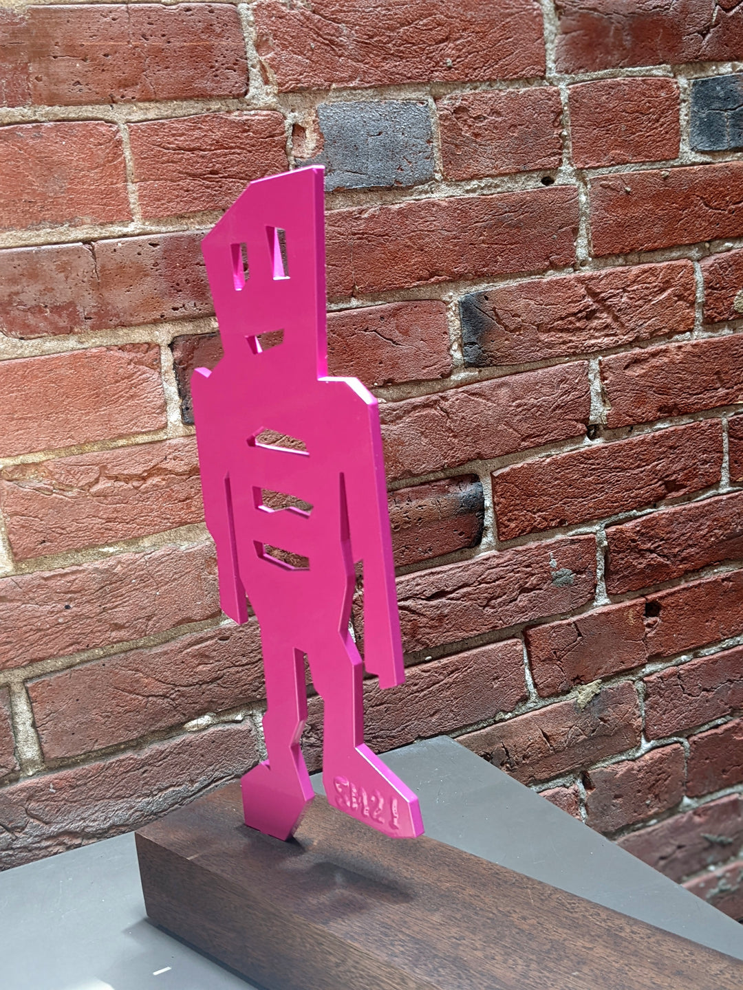 detail of The Wanderer, sculpture by Stikman. Laser-cut powder coated steel. 13 inches tall.